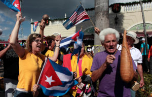 People celebrate a day after the announcement of the death of Cuban revolutionary leader Fidel Castro in the Little Havana district of Miami Nov. 27. Castro, who seized power in a 1959 revolution and governed Cuba until 2006, died Nov. 25 at the age of 90. (CNS photo/Javier Galeano, Reuters) See CASTRO-DEATH-POPE-WENSKI Nov. 27, 2016.