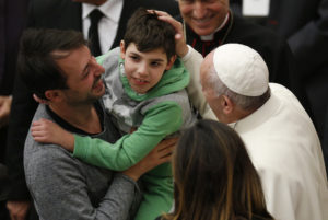 Pope Francis greets a boy while meeting the disabled during his general audience in Paul VI hall at the Vatican Nov. 30. (CNS photo/Paul Haring) See POPE-AUDIENCE-DEPARTED Nov. 30, 2016.