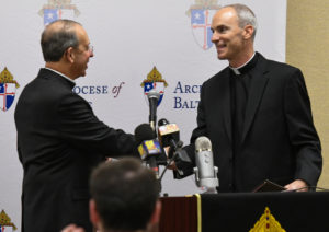 Baltimore Archbishop William Lori congratualtes Bishop-Designate Adam parker at Dec. 5 press conference. Photo by Kevin Parks, Catholic Review