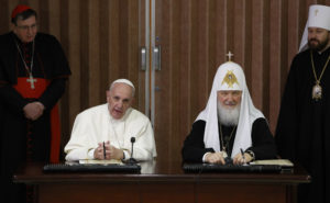 Pope Francis and Russian Orthodox Patriarch Kirill of Moscow attend a ceremony to sign a joint declaration during a meeting at Jose Marti International Airport in Havana Feb. 12. The historic meeting marked the first time a pope and a Russian Orthodox patriarch had met since the schism of 1054. Also pictured are Swiss Cardinal Kurt Koch, president of the Pontifical Council for Promoting Christian Unity, and Metropolitan Hilarion of Volokolamsk, head of external relations for the Russian Orthodox Church. (CNS photo/Paul Haring) See VATICAN-LETTER-POPE-YEAR Dec. 1, 2106.
