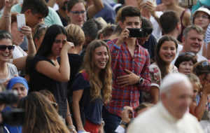 Pilgrims react as Pope Francis greets the crowd during his general audience in St. Peter's Square at the Vatican Aug. 31. The Vatican says 3.9 million pilgrims visited Rome during the Jubilee year. (CNS photo/Paul Haring) See POPE-VISITORS Dec. 29, 2016.