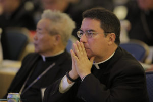 Bishop Oscar Cantu of Las Cruces, N.M., prays Nov. 16 during the opening of the 2015 fall general assembly of the U.S. Conference of Catholic Bishops in Baltimore. (CNS photo/Bob Roller) See BISHOPS- Nov. 16, 2015.
