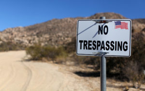 A sign stands on a private property near the U.S.-Mexico border fence in Jacumba, Calif. Despite the apprehension over policies that could be enacted by a Republican-led Congress acting in accord with a Republican president in Donald Trump, the U.S. Catholic bishops remain hopeful that  an immigration reform bill will pass. (CNS photo/Mike Blake, Reuters) See IMMIGRATION-REFORM Jan. 17, 2017.