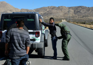 A U.S. Border Patrol agent frisks a man Jan. 11 near the U.S.-Mexico border fence in Jacumba, Calif. Despite the apprehension over policies that could be enacted by a Republican-led Congress acting in accord with a Republican president in Donald Trump, the U.S. Catholic bishops remain hopeful that an immigration reform bill will pass. (CNS photo/Mike Blake, Reuters) See IMMIGRATION-REFORM Jan. 17, 2017.