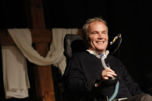 Detective Steven McDonald of the New York Police Department, who was shot and paralyzed in the line of duty in 1986, smiles as he addresses the audience during a Catholic men's conference at Holy Trinity Diocesan High School in Hicksville, N.Y., in 2009. McDonald died Jan. 10 at a Long Island hospital at age 59. (CNS photo/Gregory A. Shemitz, Long Island Catholic) See OBIT-MCDONALD Jan. 11, 2017.