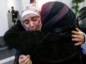 Syrian refugee Baraa Haj Khalaf is greeted by her mother, Fattoum Haj Khalaf, after arriving Feb. 7 at O'Hare International Airport in Chicago. (CNS photo/Kamil Krzaczynski, Reuters) See REFUGEES-VASQUEZ-APPEAL Feb. 10, 2017.