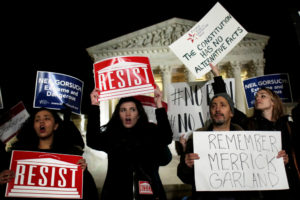 Protesters rally outside the Supreme Court in Washington Jan. 31 against President Donald Trump's Supreme Court nominee Judge Neil Gorsuch. If confirmed, Gorsuch will fill the seat that has been empty since the death of Justice Antonin Scalia last February. (CNS photo/Yuri Gripas, Reuters) See SCOTUS-TRUMP-NOMINEE Feb. 1, 2017.