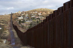 The bollard steel border fence splits the U.S. from Mexico in this view west of central Nogales, Ariz., Feb. 19. (CNS photo/Nancy Wiechec)
