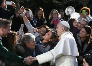 Pope Francis poses for a selfie as he greets the crowd outside St. Mary Josefa Church as he arrives to celebrate Mass at the parish in Rome Feb. 19. (CNS photo/Paul Haring) See POPE-PARISH-MASS Feb. 19, 2017.