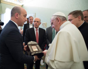 Pope Francis accepts a gift from Jonathan Greenblatt, CEO and national director of the Anti-Defamation League, during a meeting with a delegation from the organization at the Vatican Feb. 9. The pope denounced anti-Semitism and reaffirmed that the Catholic Church has a duty to repel such hatred. (CNS photo/L'Osservatore Romano, handout) See POPE-JEWISH-ADL Feb. 9, 2017.