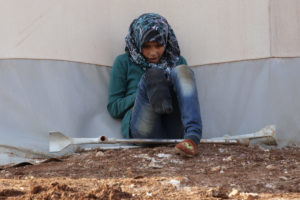 A Syrian girl with an amputated leg sits outside a tent Jan. 19 at Syria's Bab Al-Salam camp for displaced in Azaz, near the Turkish border. When it comes to helping the poor, the marginalized and refugees, Pope Francis urged Catholics not to mimic the "Mannequin Challenge" by just looking on, frozen and immobile. (CNS photo/Khalil Ashawi, Reuters) See POPE-PRAYER-REFUGEES Feb. 2, 2017