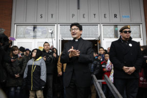 Father Raul Marquez of St. Peter Parish in Portland, Oregon, thanks people who came to stand vigil outside his church Feb. 5. The crowd formed a human shield a week after a group of eight men stood outside the front door of the church during a Spanish Mass and yelled insults about Catholicism, immigrants and the morals of the parish women. (CNS photo/Francisco Lara, Catholic Sentinel) See PORTLAND-CHURCH-HARASSMENT Feb. 8, 2017.