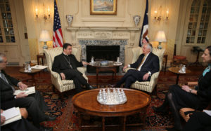 Bishop Oscar Cantu of Las Cruces, N.M., gestures during a March 23 meeting with U.S. Secretary of State Rex Tillerson at the State Department in Washington. Partially obscured at left is Stephen Colecchi, director of the Office of International Justice and Peace at the U.S. Conference of Catholic Bishops. (CNS photo/Bob Roller) See story to come.