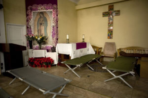 In this 2014 file photo, cots for homeless migrants are seen in the Mission Dolores church in Los Angeles. The U.S. bishops in a pastoral reflection released March 22 called all Catholics to do what each of them can "to accompany migrants and refugees who seek a better life in the United States." (CNS photo/David Maung, EPA) See BISHOPS-REFLECTION-MIGRANTS-REFUGEES March 22, 2017.
