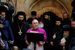 Archbishop Giuseppe Lazzarotto, papal nuncio to Israel and Cyprus and apostolic delegate in Jerusalem and the Palestinian territories, talks during a ceremony marking the end of restoration work on the site of Jesus' tomb at the Church of the Holy Sepulcher March 22. (CNS photo/Menahem Kahana, Reuters) See JERUSALEM-EDICULE-REOPEN March 22, 2017.