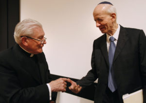 Cardinal William H. Keeler, retired archbishop of Baltimore, greets Rabbi Irving Greenberg, founder and president of the National Jewish Center for Learning and Leadership, after a Feb. 26, 2009, news conference at the Pope John Paul II Cultural Center in Washington. Cardinal Keeler died March 23. He was 86. (CNS photo/Bob Roller) See OBIT-KEELER March 23, 2017.