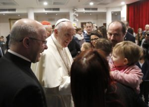 Pope Francis greets a family during a March 12 visit at the Rome parish of St. Magdalene of Canossa. (CNS photo/Alessandro Bianchi, Reuters) See POPE-PARISH-LENT March 13, 2017.