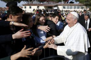 Pope Francis greets people March 12 during a visit at the Rome parish of St. Magdalene of Canossa. (CNS photo/Alessandro Bianchi, Reuters) See POPE-PARISH-LENT March 13, 2017.