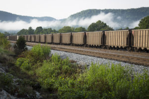 A train carries coal near Ravenna, Ky., in this 2014 file photo. Bishop Frank J. Dewane of Venice, Fla., chairman of the bishop's Committee on Domestic Justice and Human Development, said in a statement March 29 that President Donald Trump's executive order calling for a review of the Clean Power Plan jeopardizes environmental protections and moves the country away from a national carbon standard. (CNS photo/Tyler Orsburn) See USCCB-ENVIRONMENT-GOALS March 30, 2017.