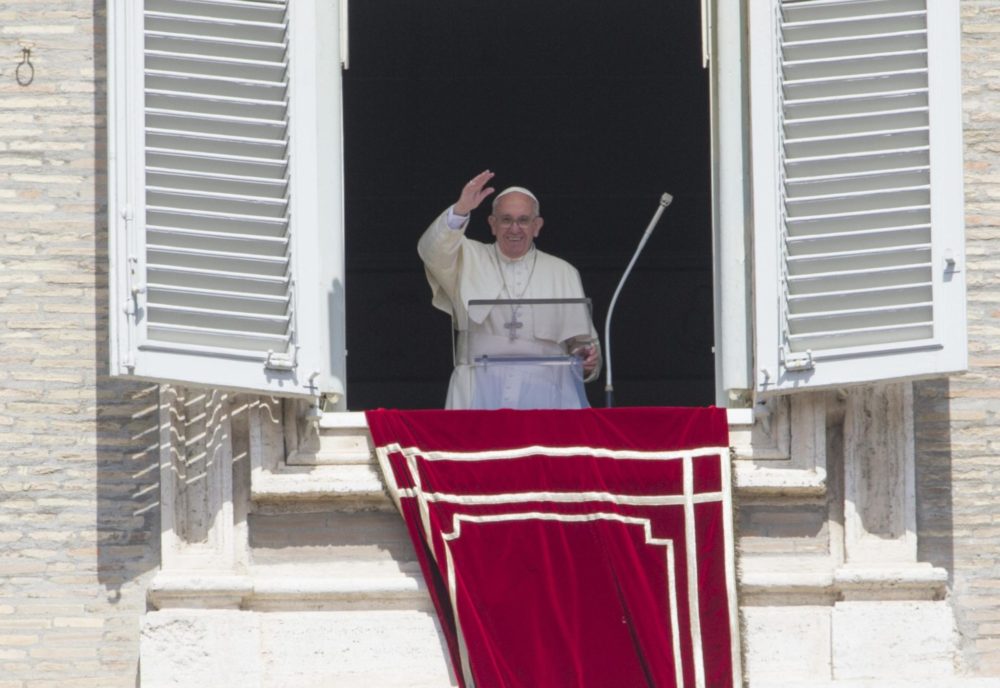 Pope Francis waves to the crowd from the window of his studio overlooking St. Peter's Square during the "Regina Coeli" at the Vatican April 17. (CNS photo/Giorgio Onorati, EPA)