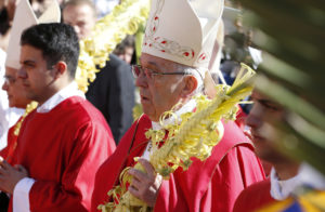 Pope Francis carries palm fronds in procession during Palm Sunday Mass in St. Peter's Square at the Vatican April 9. (CNS photo/Paul Haring) See POPE-PALM-SUNDAY April 9, 2017.