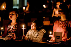 Young people hold candles during the Easter Vigil in 2015 at the Cathedral of St. Joseph in Hartford, Conn. The Roman Missal, which spells out specifics of how the vigil is to be celebrated, describes it as the "mother of all vigils." (CNS photo/Bob Mullen) See EASTER-VIGIL-MASS April 7, 2017.