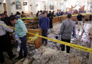 Security personnel investigate the scene of a bomb explosion April 9 inside the Orthodox Church of St. George in Tanta, Egypt. That same day an explosion went off outside the Cathedral of St. Mark in Alexandria where Coptic Orthodox Pope Tawadros II was presiding over the  Palm Sunday service. (CNS photo/Khaled Elfiqi, EPA) See EGYPT-CHURCHES-REACTION April 10, 2017.