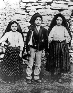 Jacinta and Francisco Marto are pictured with their cousin Lucia dos Santos (right) in a file photo taken around the time of the 1917 apparitions of Mary at Fatima, Portugal. Pope Francis has approved the recognition of a miracle attributed to the intercession of two of the shepherd children, thus paving the way for their canonization. (CNS file photo) See POPE-FATIMA-MIRACLE March 23, 2017.