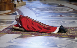 Pope Francis lies prostrate as he leads the Good Friday service in St. Peter's Basilica at the Vatican April 14. (CNS photo/Paul Haring) See POPE-GOOD-FRIDAY April 14, 2017.