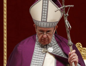 Pope Francis holds his crosier during a Lenten penance service in St. Peter's Basilica at the Vatican March 17. (CNS photo/Paul Haring) See POPE-LENT March 17, 2017.