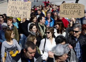 People take part in a Feb. 26 march to support refugees in San Sebastian, Spain. Members of the Catholic Church have an obligation to recognize the value of welcoming newcomers, Pope Francis said. (CNS photo/Javier Etxezarreta, EPA) See POPE-IMMIGRATION-POLICY April 7, 2017.