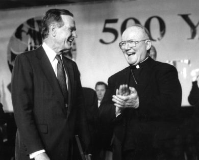 Bishop Thomas V. Daily of Brooklyn, N.Y., applauds as he shares a laugh with President George H. Bush in 1992. Bishop Daily, who retired in 2003, died May 15 at Immaculate Conception Center's Bishop Mugavero Residence in the Queens borough of New York City. (CNS photo/Ed Wilkinson, The Tablet) See OBIT-DAILY May 15, 2017.