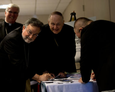 Bishop Jaime Soto of Sacramento, Calif., and Bishop Richard E. Pates of Des Moines, Iowa, pose for a photo while singing pledges to end the death penalty at the U.S. Conference of Catholic Bishops building in Washington May 9. (CNS photo/Tyler Orsburn) See DEATH-PENALTY-PLEDGE May 9, 2017.