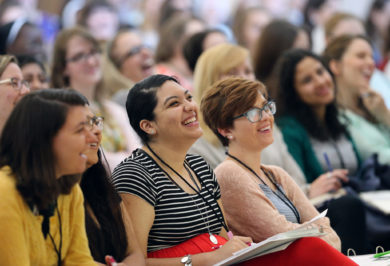 Women laugh as they listen to a keynote speaker during a leadership forum for young Catholic women in 2016 at The Catholic University of America in Washington. In dioceses across the U.S., the 300 attendees are now implementing their "action plans," new initiatives inspired by their gifts, interests and leadership skills.(CNS photo/Bob Roller) See GIVEN-INITIATIVES May 19, 2017.