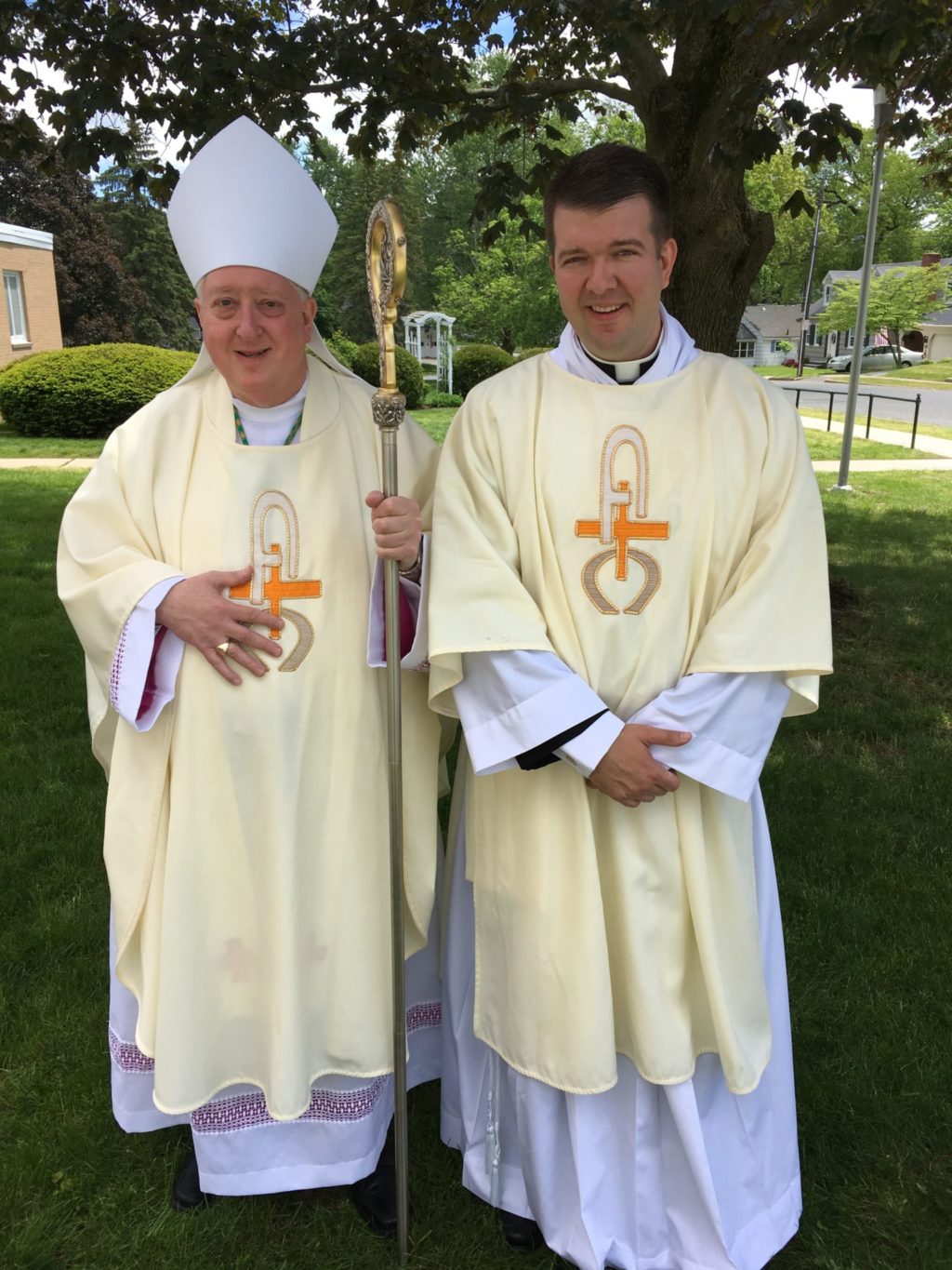 Springfield Bishop Mitchell T. Rozanski stands with Deacon Michael ...