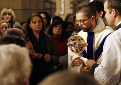 Dominican Father Thomas More Garrett holds a reliquary containing a first-class relic of St. John Paul II following a Mass marking the dedication of a shrine to the late pope May 13 at St. Vincent Ferrer Church in New York City. The liturgy coincided with the 100th anniversary of the first Marian apparition in Fatima, Portugal, and the 36th anniversary of the assassination attempt on St. John Paul. (CNS photo/Gregory A. Shemitz) See FATIMA-JPII-SHRINE-NEWYORK May 16, 2017.