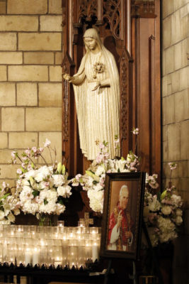 A statue of Our Lady of Fatima and a portrait of St. John Paul II are seen during a Mass marking the dedication of the St. John Paul II shrine May 13 at St. Vincent Ferrer Church in New York City. The liturgy coincided with the 100th anniversary of the first Marian apparition in Fatima, Portugal, and the 36th anniversary of the assassination attempt on St. John Paul. (CNS photo/Gregory A. Shemitz) See FATIMA-JPII-SHRINE-NEWYORK May 16, 2017.