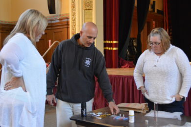 Presenter Eric Stratton shows how everyday items can be used to conceal drugs. Photo by Jen Lopez, Pope Francis HS