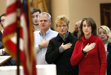 People recite the Pledge of Allegiance at the beginning of a presentation on religious freedom at St. Patrick Church in Smithtown, N.Y., Jan. 3, 2016. (CNS photo/Gregory A. Shemitz) See WASHINGTON-LETTER-TRUMP-ORDER May 5, 2017.