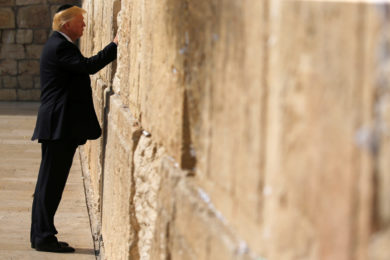 U.S. President Donald Trump places a note in the Western Wall in Jerusalem May 22. (CNS photo/Jonathan Ernst, Reuters) See TRUMP-JERUSALEM-HOLY-SEPULCHER May 22, 2017.