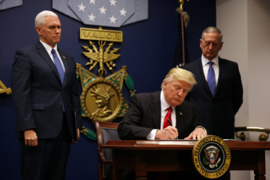 U.S. President Donald Trump signs a revised executive order for a U.S. travel ban March 6 at the Pentagon in Arlington, Va. The executive order temporarily bans refugees from certain majority-Muslim countries, and now excludes Iraq. (CNS photo/Carlos Barria, Reuters) See REFUGEE-TRAVEL-BAN-REVISED March 6, 2017.