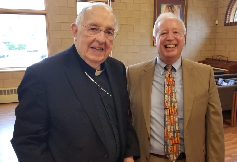 Retiring finance officer William LaBroad poses with Springfield Bishop ...