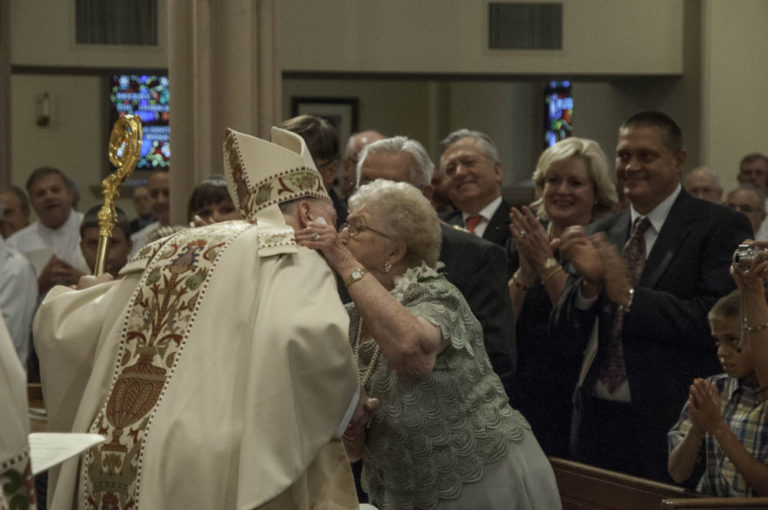 Jen Rozanski Jean Rozanski kisses her newly ordained son, Springfield Bishop ...