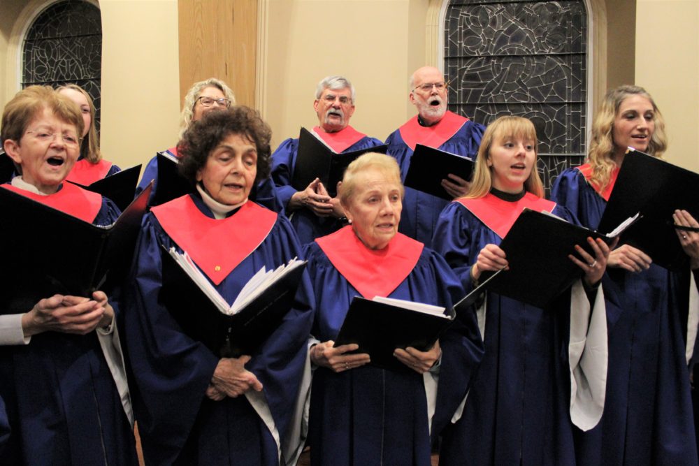 St. Cecilia Parish Adult Choir members rehearse for the Dec. 12 ...