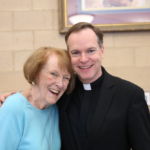 Msgr. Connelly poses with his administrative assistant Mary Ashe during St. Michael's Cathedral Parish celebration of the 25th anniversary of his priesthood ordination.