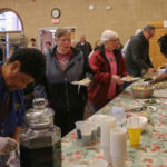 Hungry diners line up at the recent Lenten Luncheon hosted by the Ladies of St. Peter Claver at St. Michael's Cathedral in Springfield.