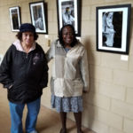 Parishioners Sharon Harris and Lauren Daley attend the opening reception for the "Images of Faith in Black and White" photo exhibit at St. Michael's Cathedral in Springfield.