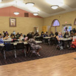Parishioners and guests gather in the Marshall Center adjacent to St. Michael's Cathedral to celebrate Juneteenth, also called African American Emancipation Day, which marks the end of slavery in the U.S.