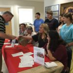 The Holy Cannoli youth group at Mt. Carmel Parish, Springfield, offer daily prizes during the month of August as a calendar fundraiser for their trip to the National Catholic Youth Conference this fall.