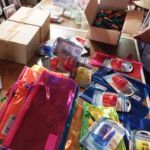 The Knights and Ladies of St. Peter Claver at St. Michael's Cathedral collect school supplies for children in need.
